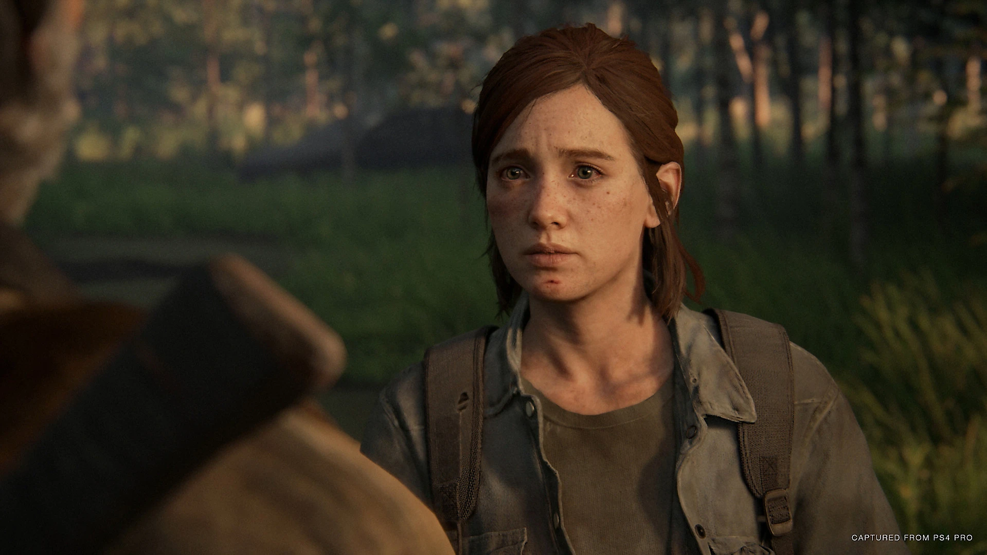 An emotional Ellie in Naughty Dog's The Last of Us Part 2